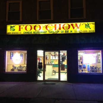 Foo Chow Restaurant storefront at night with sign lit up