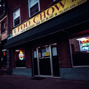 Foo Chow Restaurant sign lit up at night with neon glow